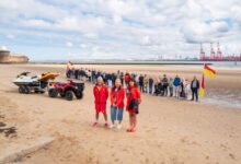 42 people lined New Brighton Beach as RNLI celebrates 25 years of lifeguards