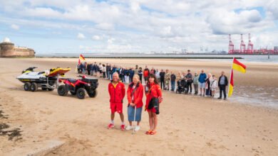 42 people lined New Brighton Beach as RNLI celebrates 25 years of lifeguards