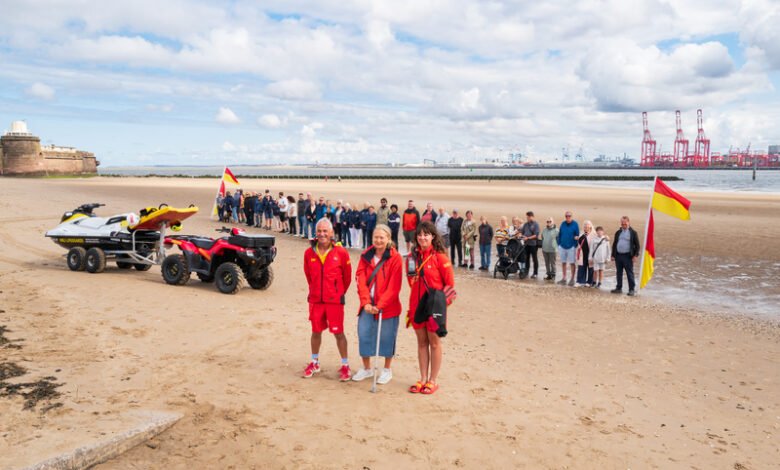 42 people lined New Brighton Beach as RNLI celebrates 25 years of lifeguards