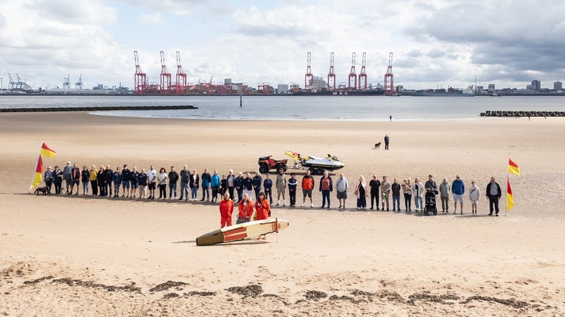 42 people lined New Brighton Beach as RNLI celebrates 25 years of lifeguards